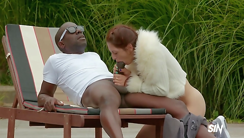 Blonde milf with a hairy pussy and big cock in the surf