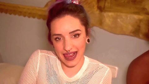 A sexy teen with tattoos shows off her body in the bed