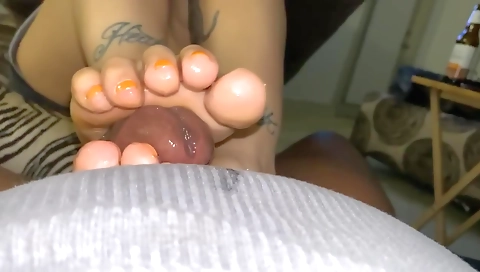 Footjob on a tattooed chick after her feet are nailed