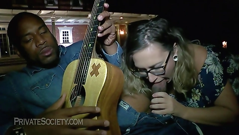 Milf and her tattooed friend having interracial sex