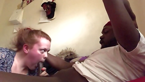 Interracial teen sucking a large dick in the bedroom